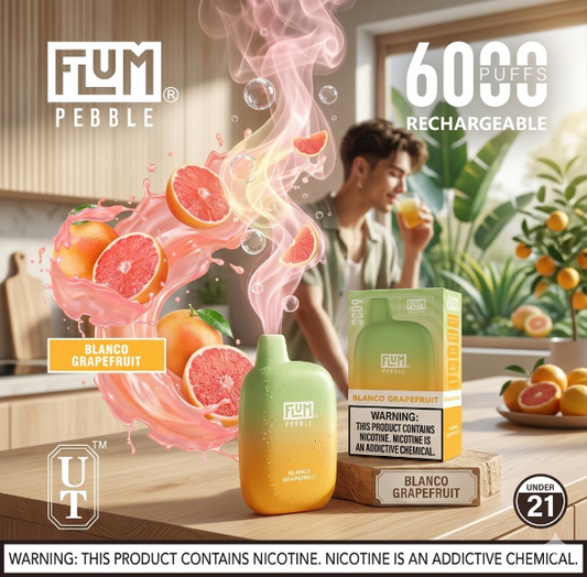 Flum Pebble vape device with Blanco Grapefruit flavor on a kitchen counter, surrounded by grapefruit and smoke effects.
